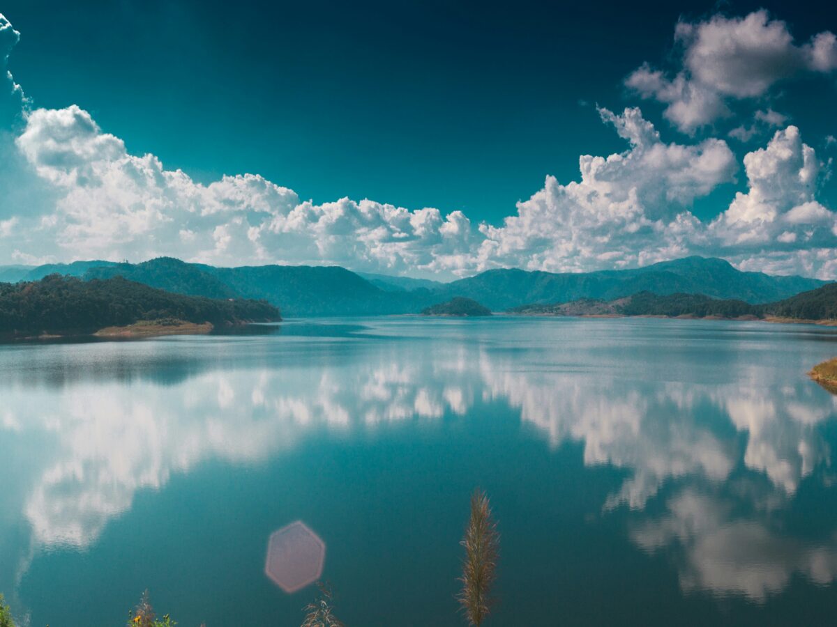 Graphic of clouds reflected on to a body of water