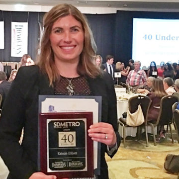 PME CEO Kristin Elliot pictured holding  San Diego Metropolitan Magazine’s coveted 40 Under 40 award.