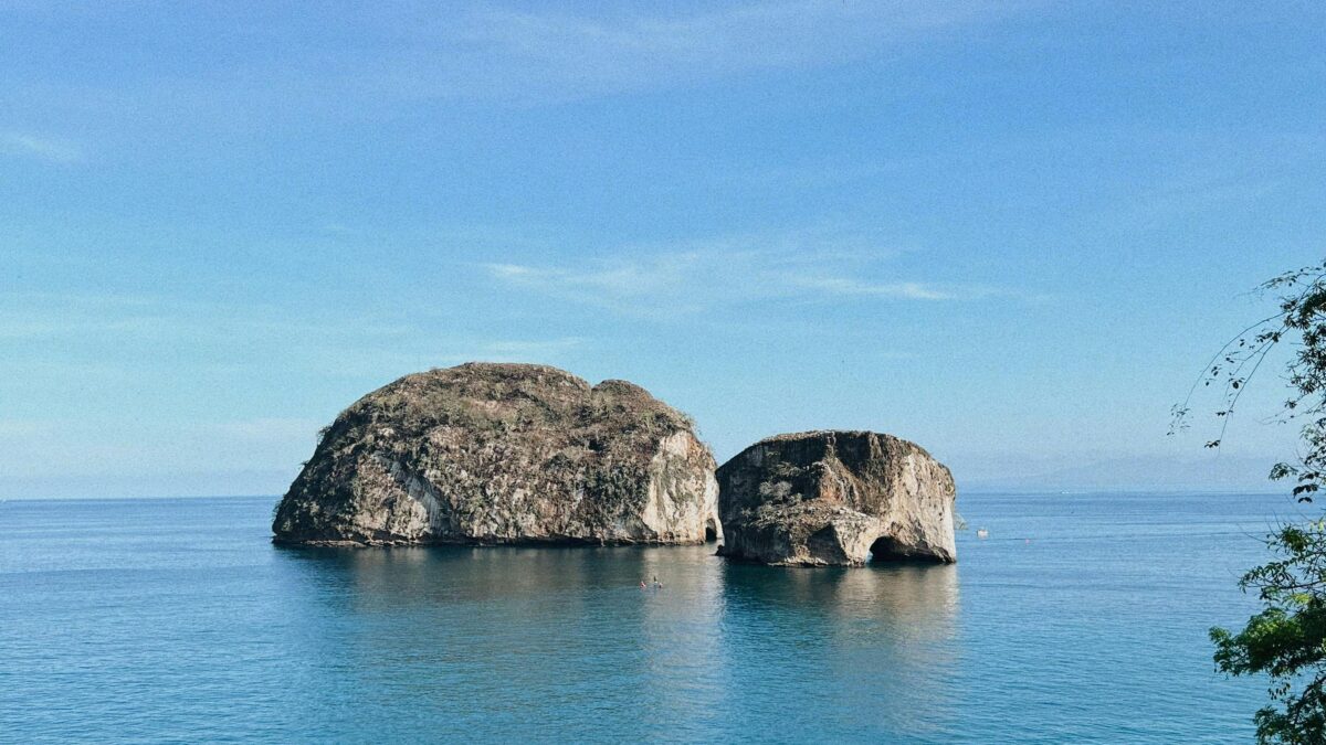 Image of Mismaloya Arches in Mexico surround by a body of open ocean.