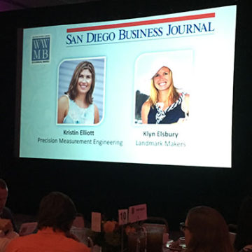 An image taken during the San Diego Business Journal Conference of a projector slideshow