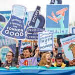 A graphic of the science community during an event displaying signs and posters.