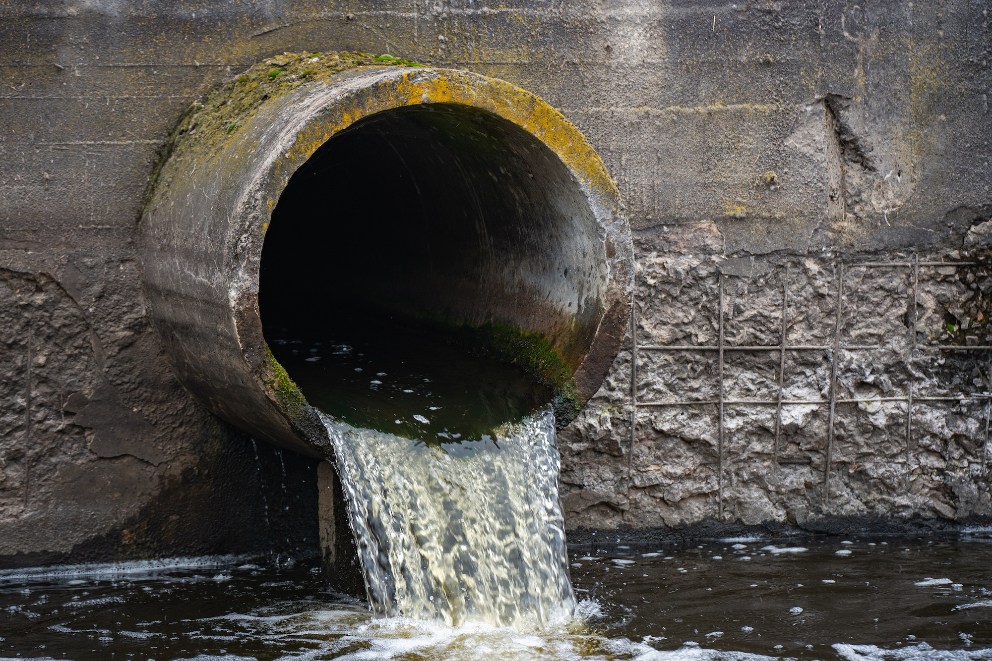 wastewater flows out of pipe